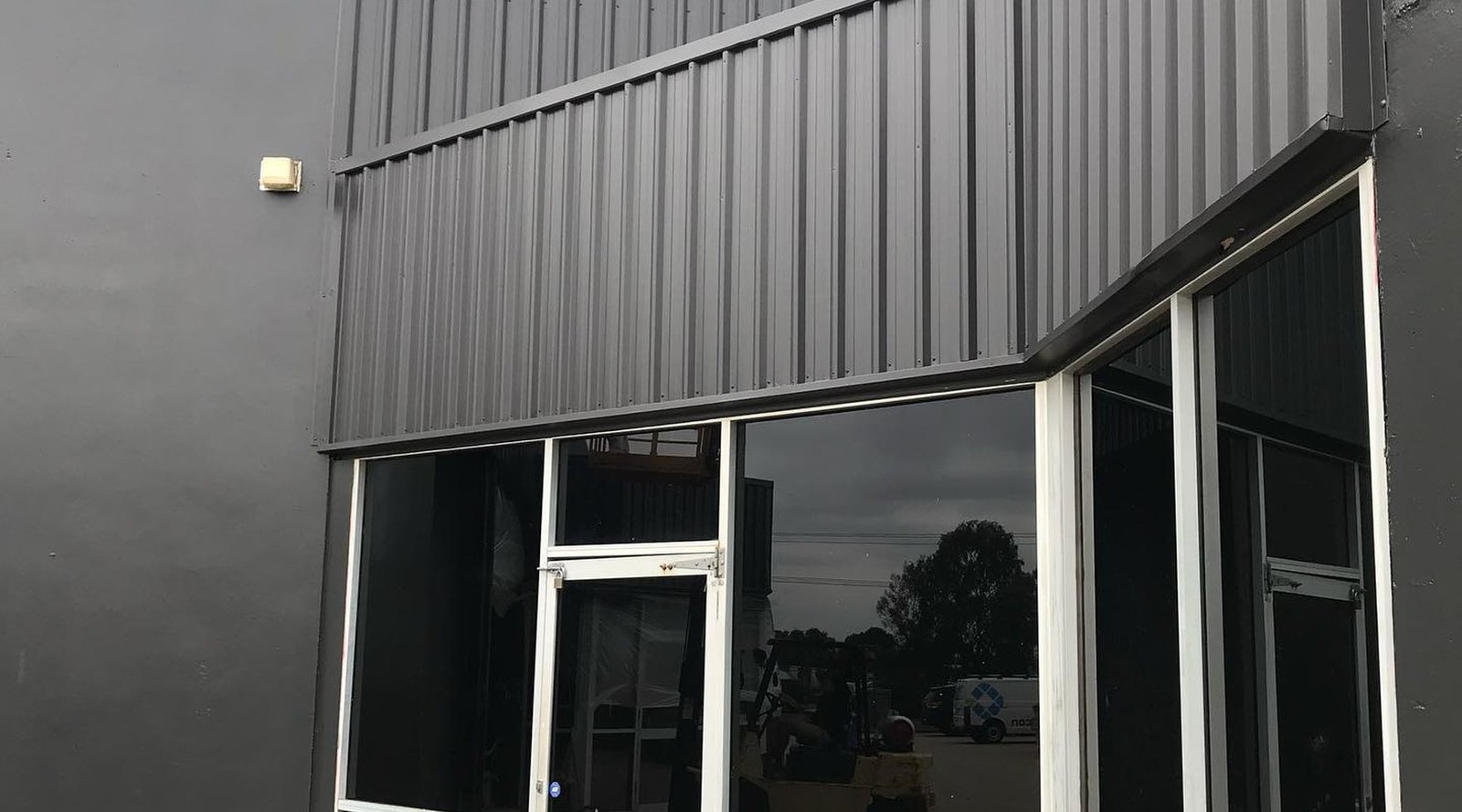 Industrial building exterior painting by Fernando Finishes